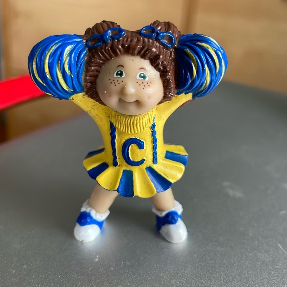 Cabbage Patch cheerleader cake topper